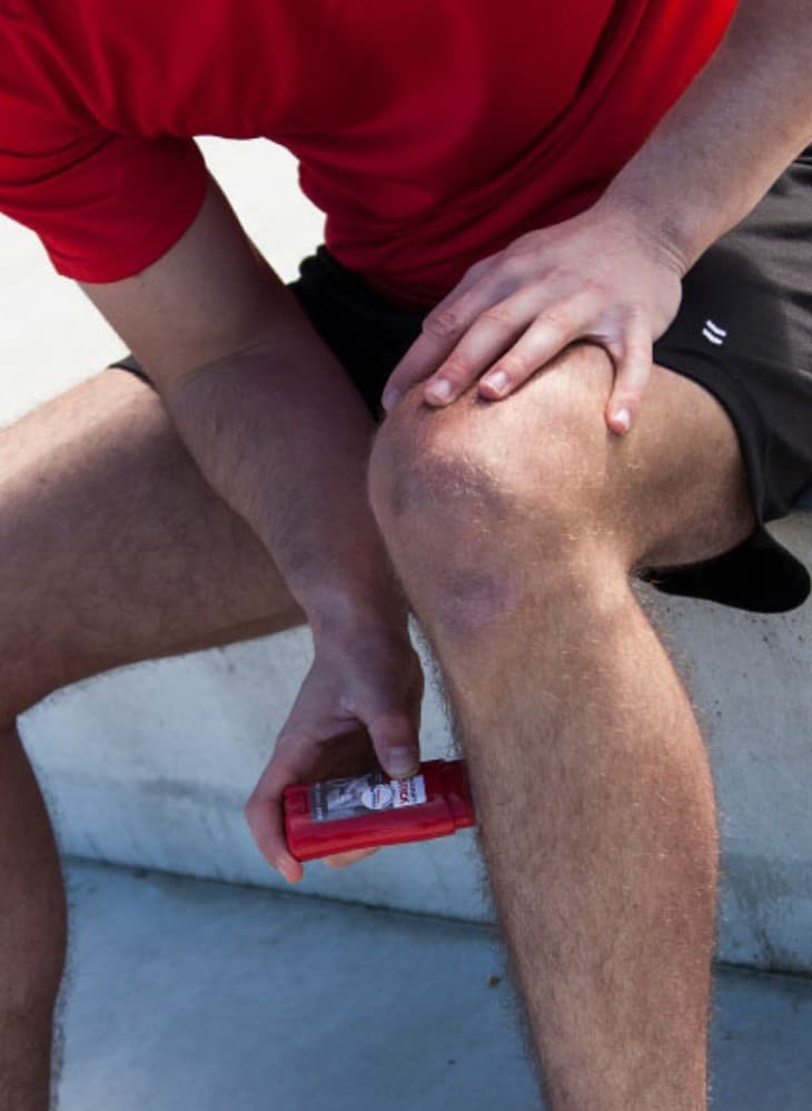 Athlete applying Starbalm before play
