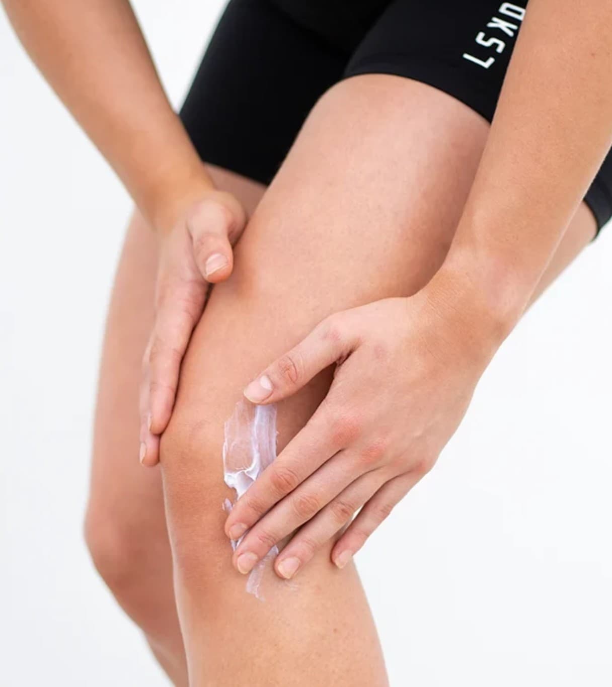 Athlete applying Starbalm post-workout